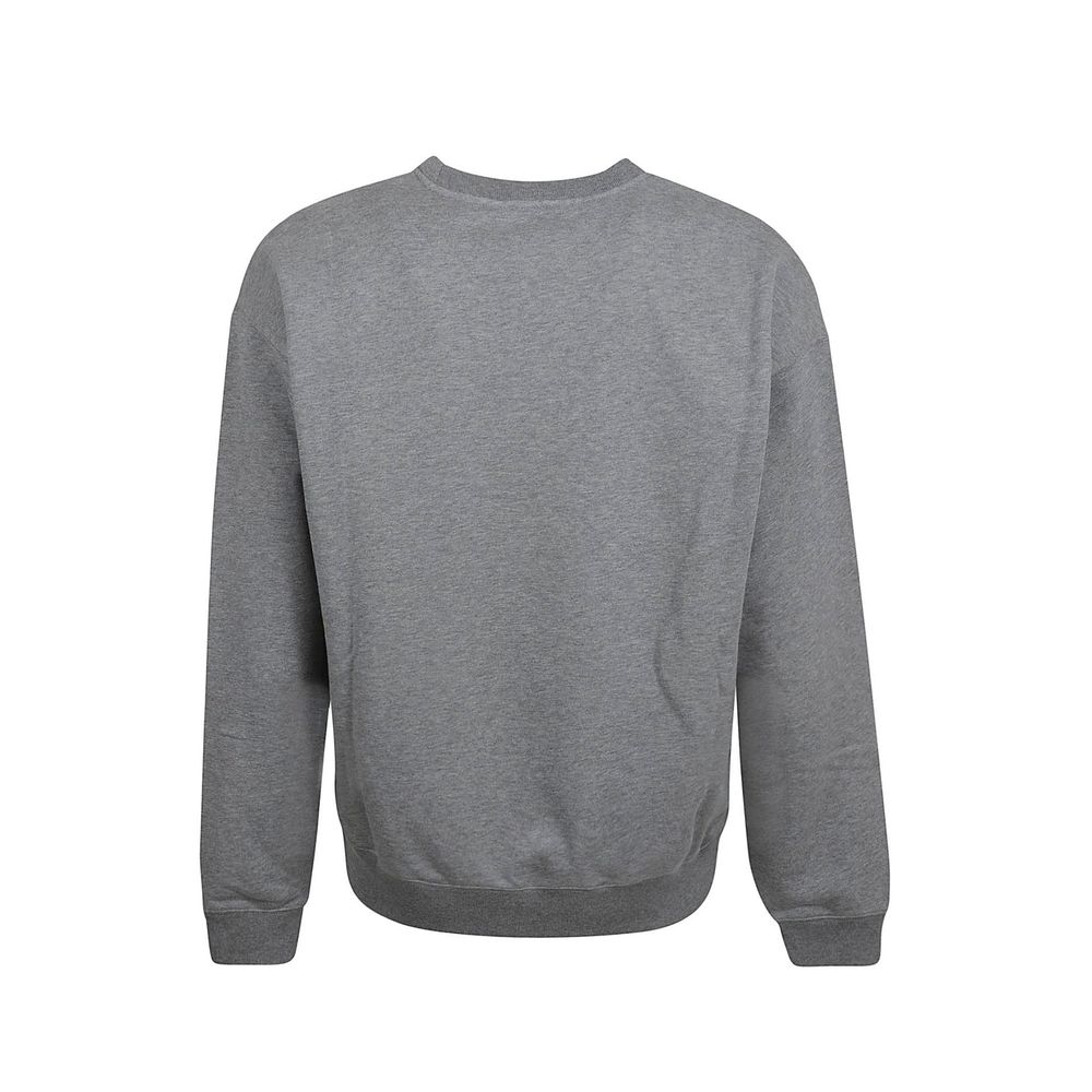 Sweatshirt gris en coton de la marque Versace, avec logo élégant visible sur le devant, pour un style décontracté et sophistiqué.