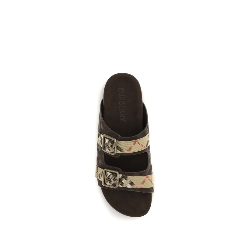 Sandales plates en cuir de veau marron Bos Taurus de Burberry, design élégant et confortable pour femmes.