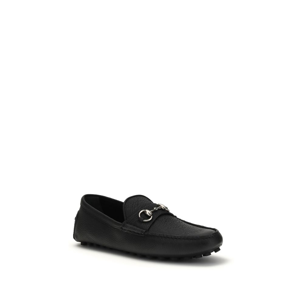 Chaussures Gucci Bos Taurus en cuir de veau noir, mocassins slip-on élégants avec design classique et finition soignée.