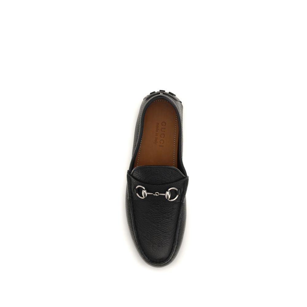 Chaussures Gucci Bos Taurus en cuir de veau noir, mocassins slip-on élégants pour homme.