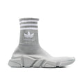 Sneakers athlétics en nylon gris BALENCIAGA X ADIDAS avec semelles blanches et design moderne.