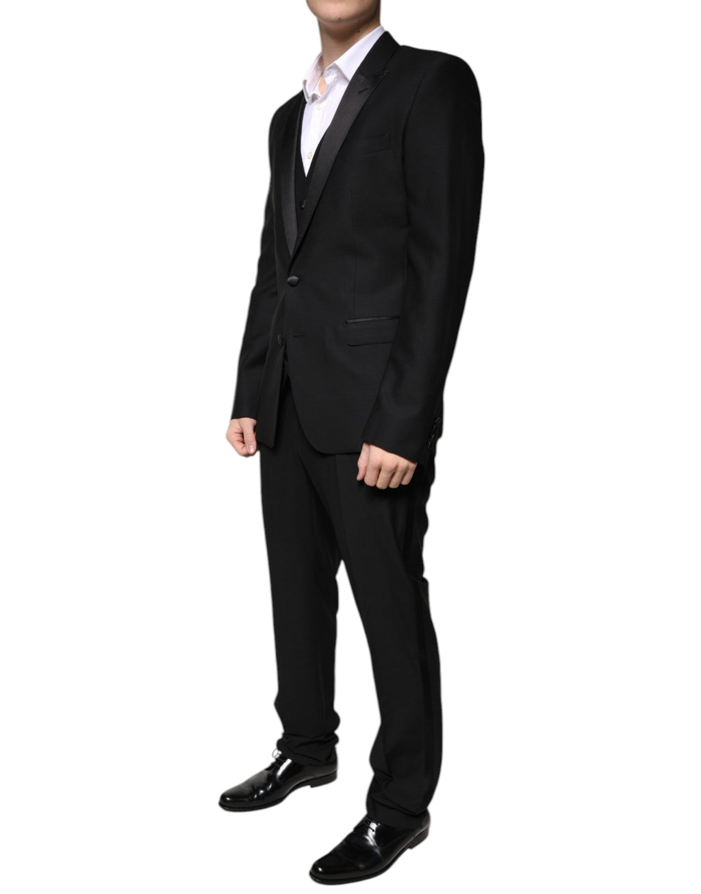 Costume de smoking noir en laine vierge de Dolce & Gabbana, élégant tuxedo pour homme, détails classiques et sophistiqués.