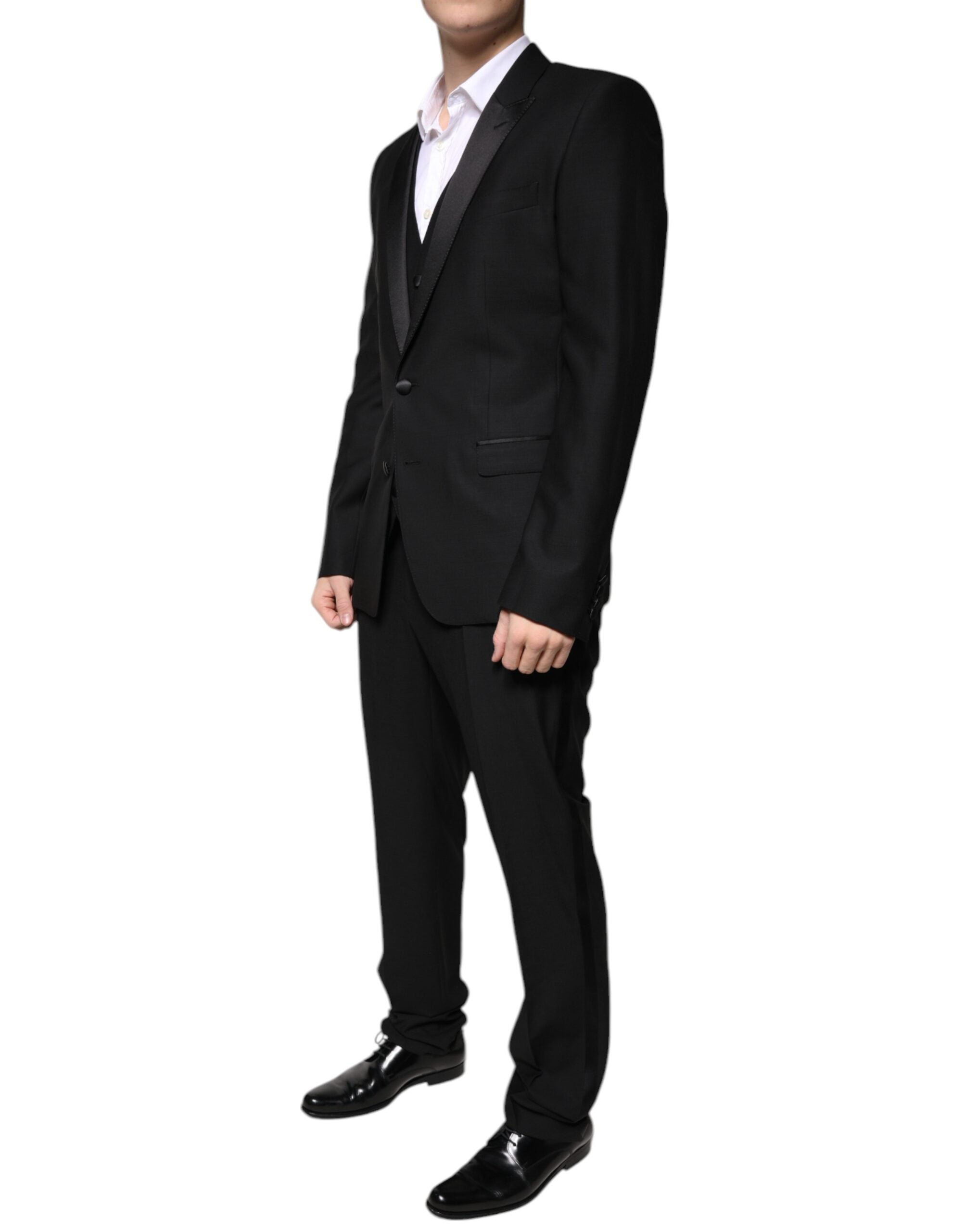 Costume de smoking noir en laine vierge de Dolce & Gabbana, élégant tuxedo pour homme, détails classiques et sophistiqués.