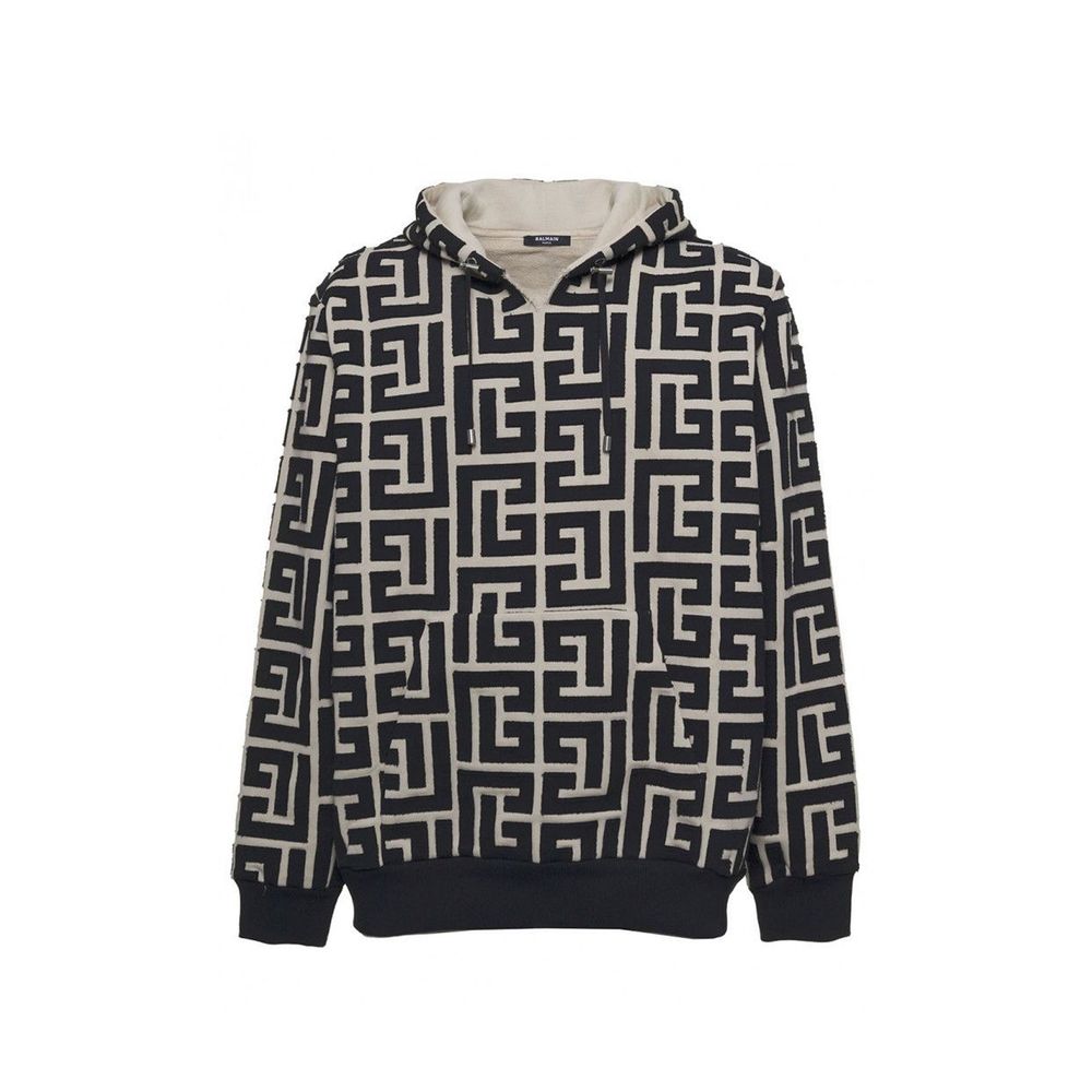 Sweatshirt beige en coton de la marque Balmain, coupe décontractée avec logo discret visible sur le devant.