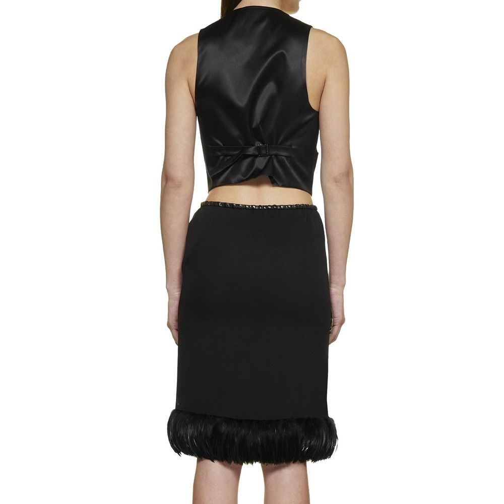 Jupe midi en soie noire de Saint Laurent, élégante et fluide, affichée sur un fond neutre.