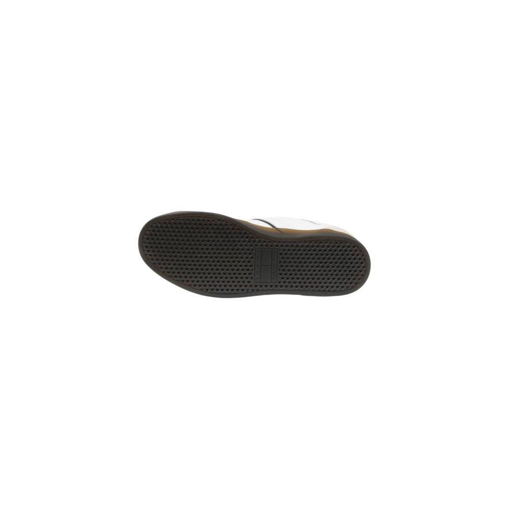 Sneakers Tommy Hilfiger Jeans noires en cuir avec semelle basse, style décontracté et moderne.