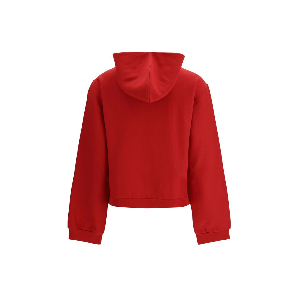 Sweat-shirt en coton multicolore de Balenciaga, décontracté avec logo distinctif, porté en mode streetwear élégant.