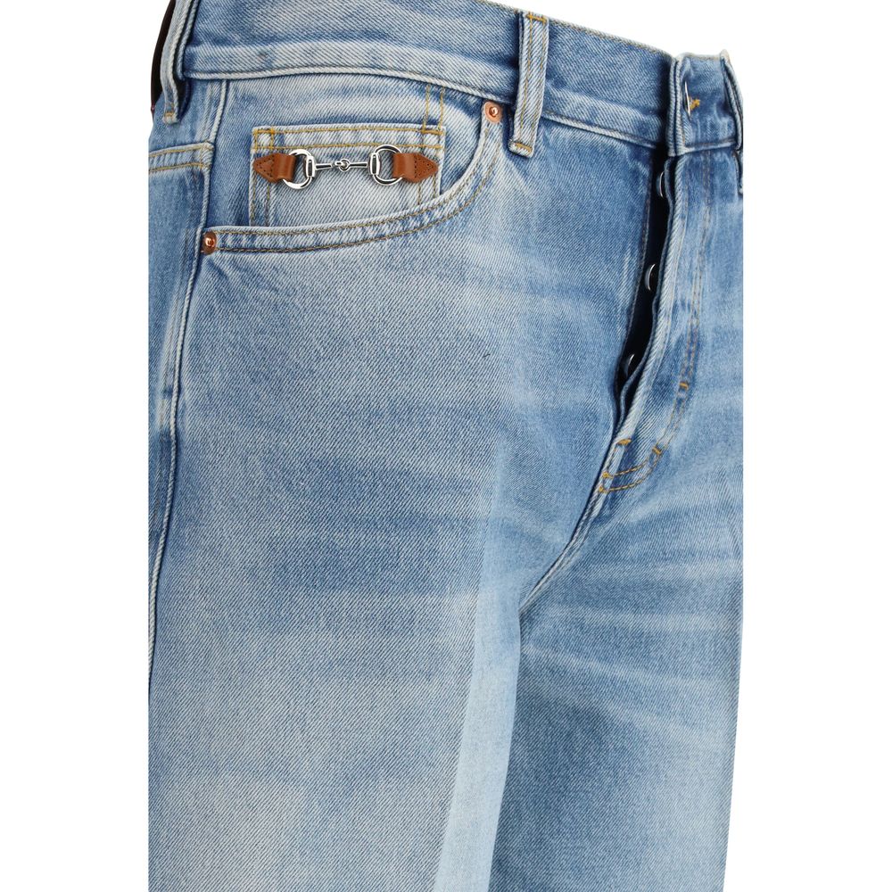 Jeans évasés en coton bleu Gucci avec détails élégants, visibles dans cette image.