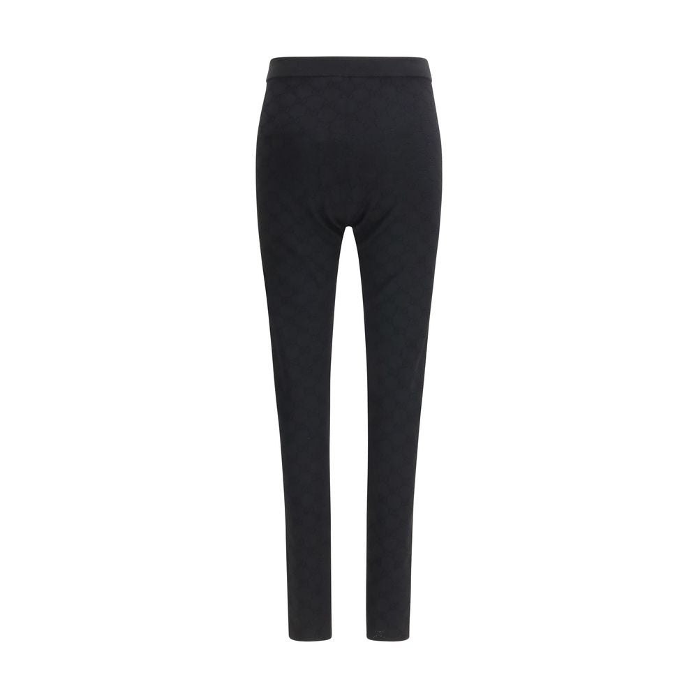Leggings en viscose noires de Gucci, ajustés et élégants, montrant la texture fluide et la coupe moderne du produit.