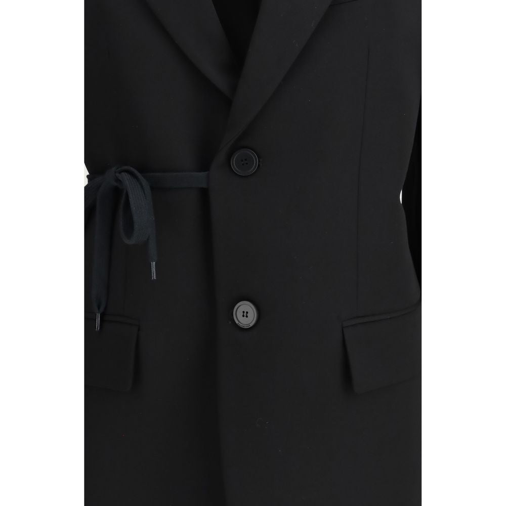 Veste en laine noire Balenciaga, coupe élégante, détails modernes, portée décontractée ou chic.