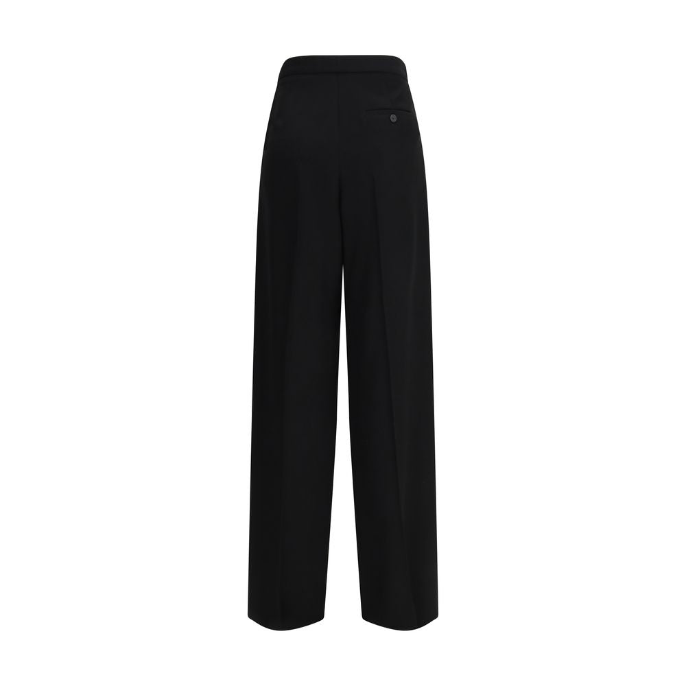 Pantalon en coton noir Balenciaga, costume élégant avec coupe moderne, porté par un mannequin dans une image de mode.
