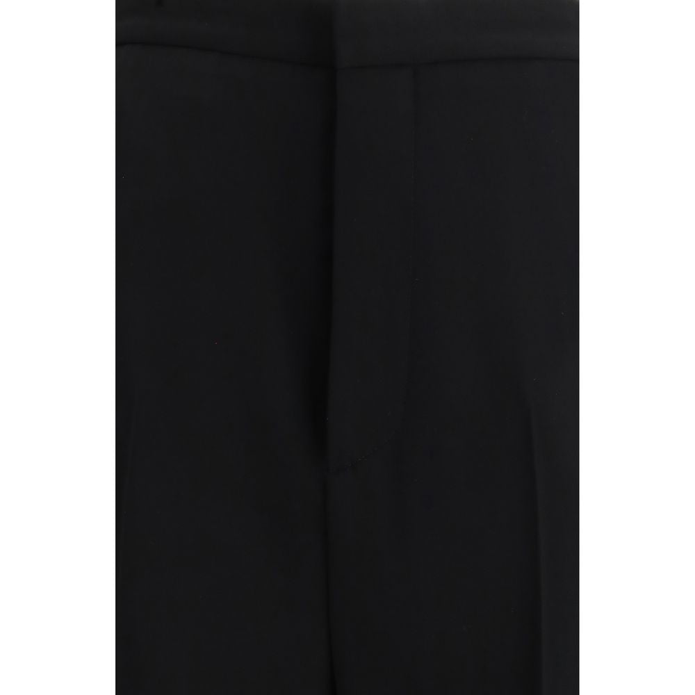 Pantalon en coton noir Balenciaga, costume pantalon pour femme, détail élégant et coupe moderne, vue sur le pantalon.