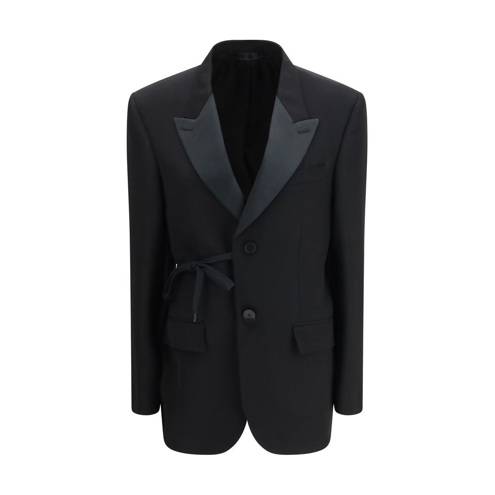 Manteau en laine noir Balenciaga, coupe élégante, porté par un mannequin, détails de finition visibles.