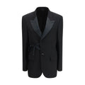 Manteau en laine noir Balenciaga, coupe élégante, porté par un mannequin, détails de finition visibles.