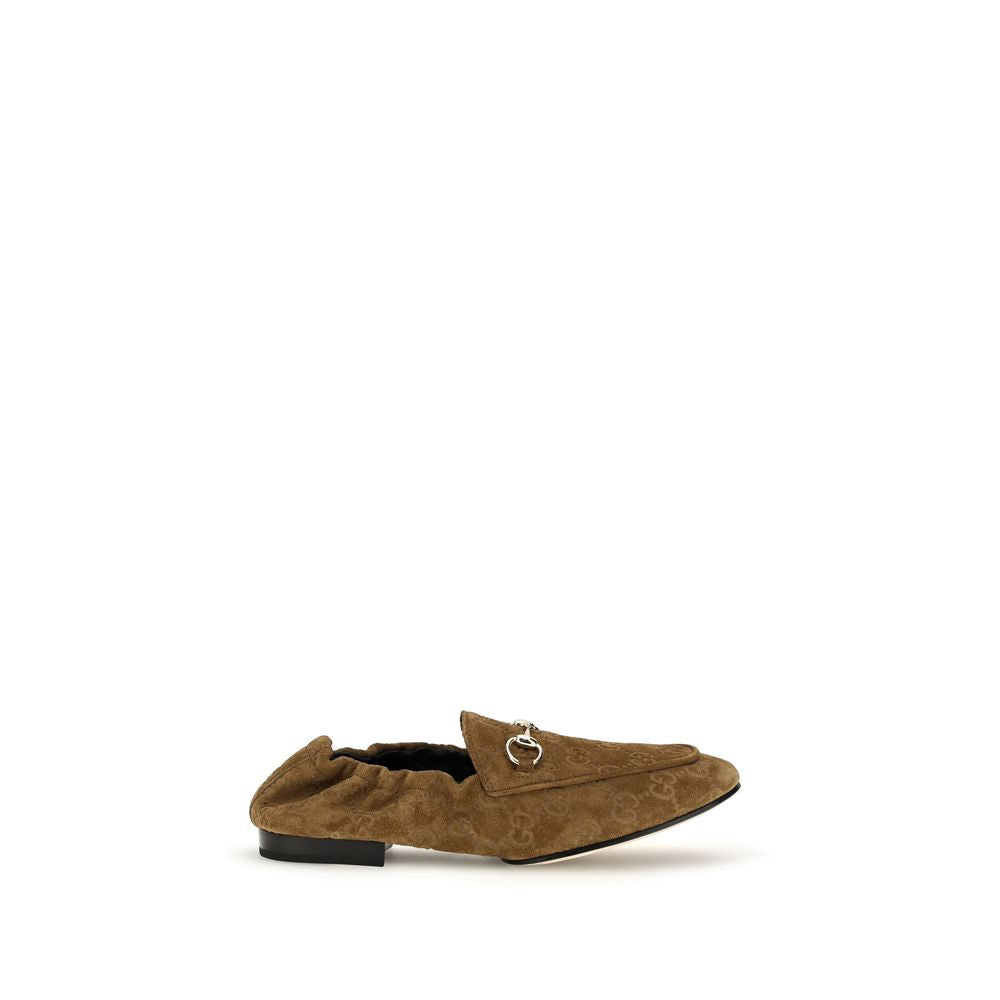 Mocassins Gucci en cuir de veau marron Bos Taurus, chaussures slip-on élégantes pour homme, avec détails raffinés.
