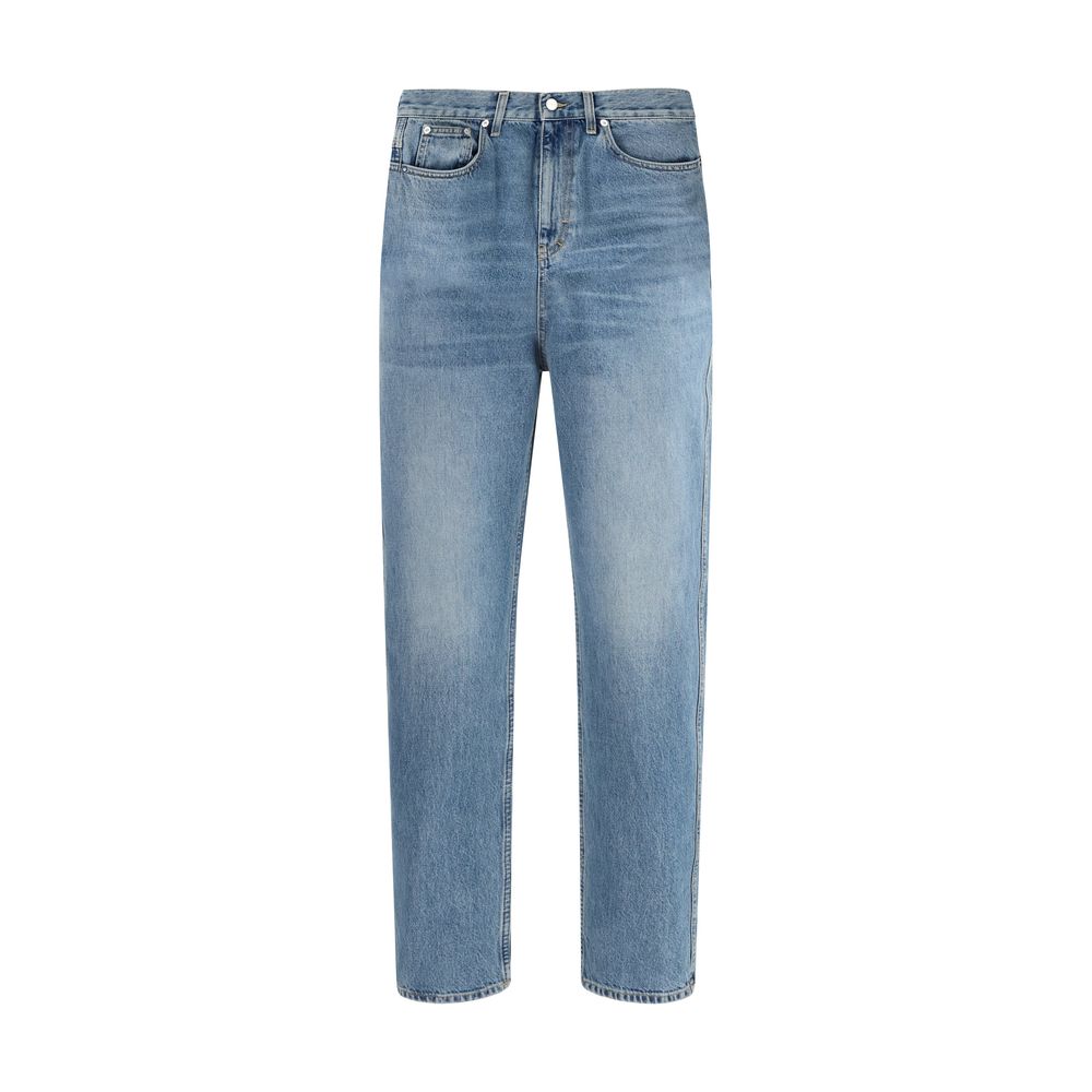 Jeans slim en coton bleu Gucci, coupe ajustée, visible avec détails de couture et logo discret sur la poche arrière.