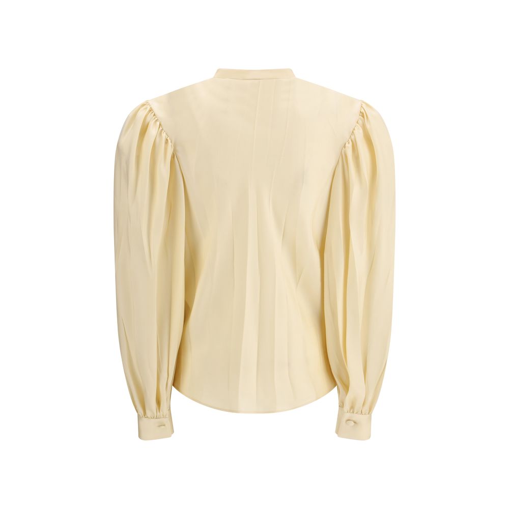 Chemise en soie beige Gucci pour femmes, élégante et sophistiquée, avec col classique et boutons visibles.