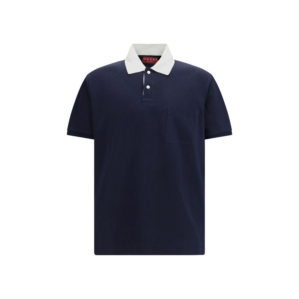 Chemise polo en coton bleu de Gucci avec col classique et logo brodé, vue de face.