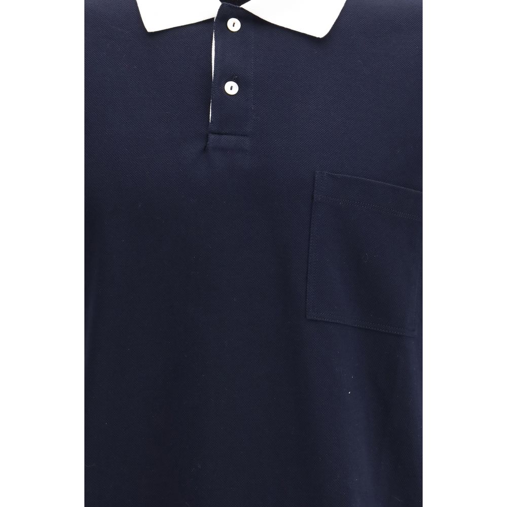Chemise polo en coton bleu Gucci, vue détaillée du vêtement avec col et logo Gucci visible.