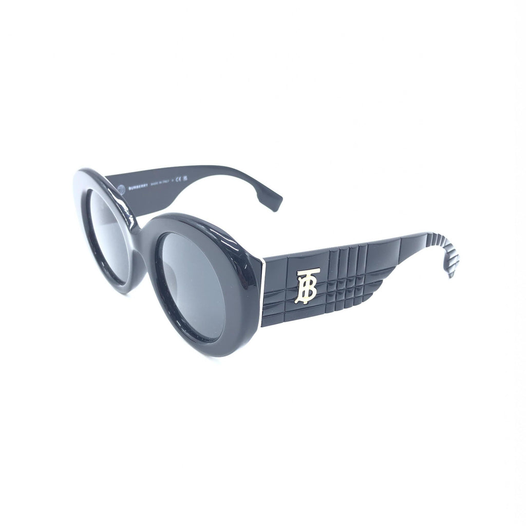 Lunettes de soleil rondes oversized noires de Burberry, style moderne avec monture épaisse et design élégant.