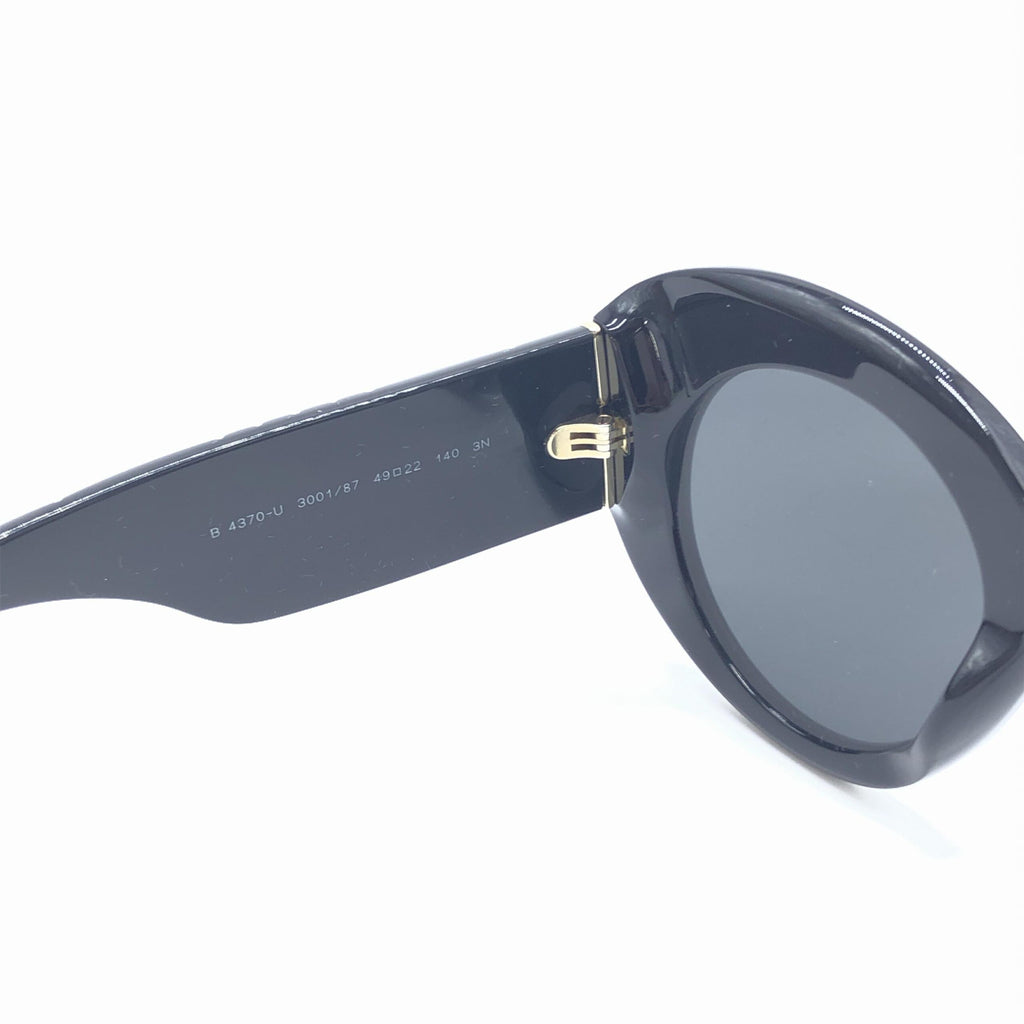Lunettes de soleil rondes oversize noires de Burberry, monture élégante et moderne, pour un style sophistiqué.