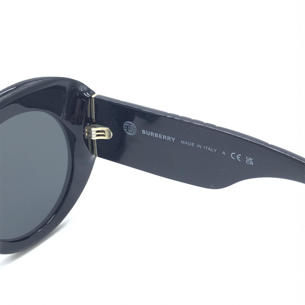 Lunettes de soleil rondes oversized noires Burberry, style élégant, monture épaisse et design tendance pour un look sophistiqué.