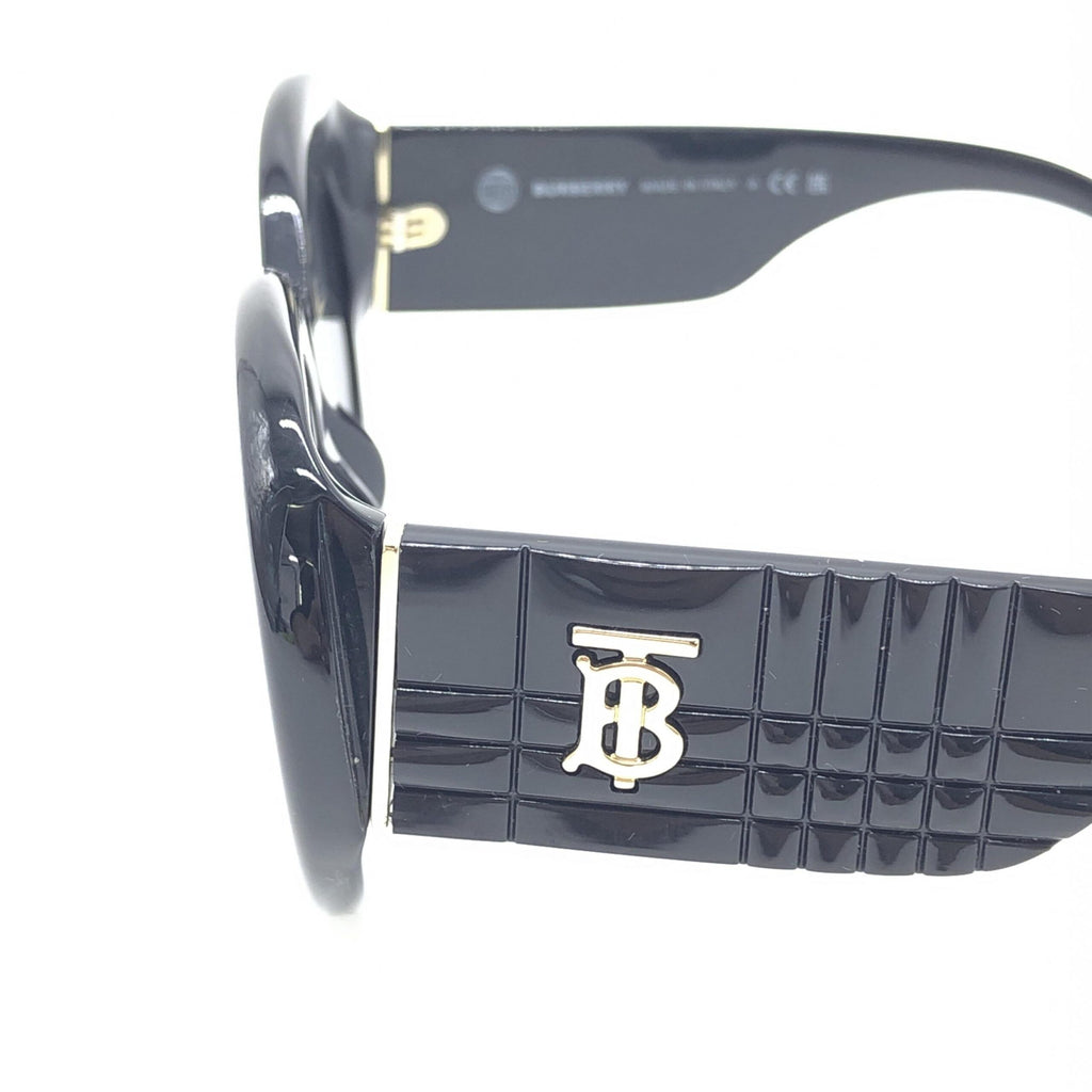 Lunettes de soleil rondes oversize noires Burberry, style élégant avec monture en plastique noir, pour un look sophistiqué.