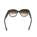 Lunettes de soleil Chanel avec monture marron et accents en tweed, design élégant et sophistiqué, vue de face.