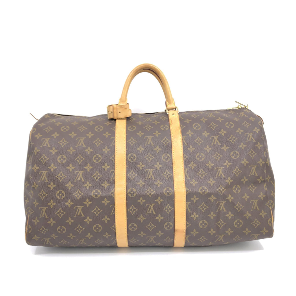 Sac à main Louis Vuitton Monogram Keepall 55 en toile avec poignées en cuir et fermeture zippée visible sur l'image.