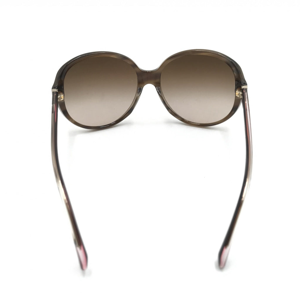 Lunettes de soleil oversize Chanel à dégradé brun, avec monture élégante et design moderne.