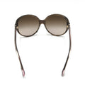 Lunettes de soleil oversize Chanel à dégradé brun, avec monture élégante et design moderne.