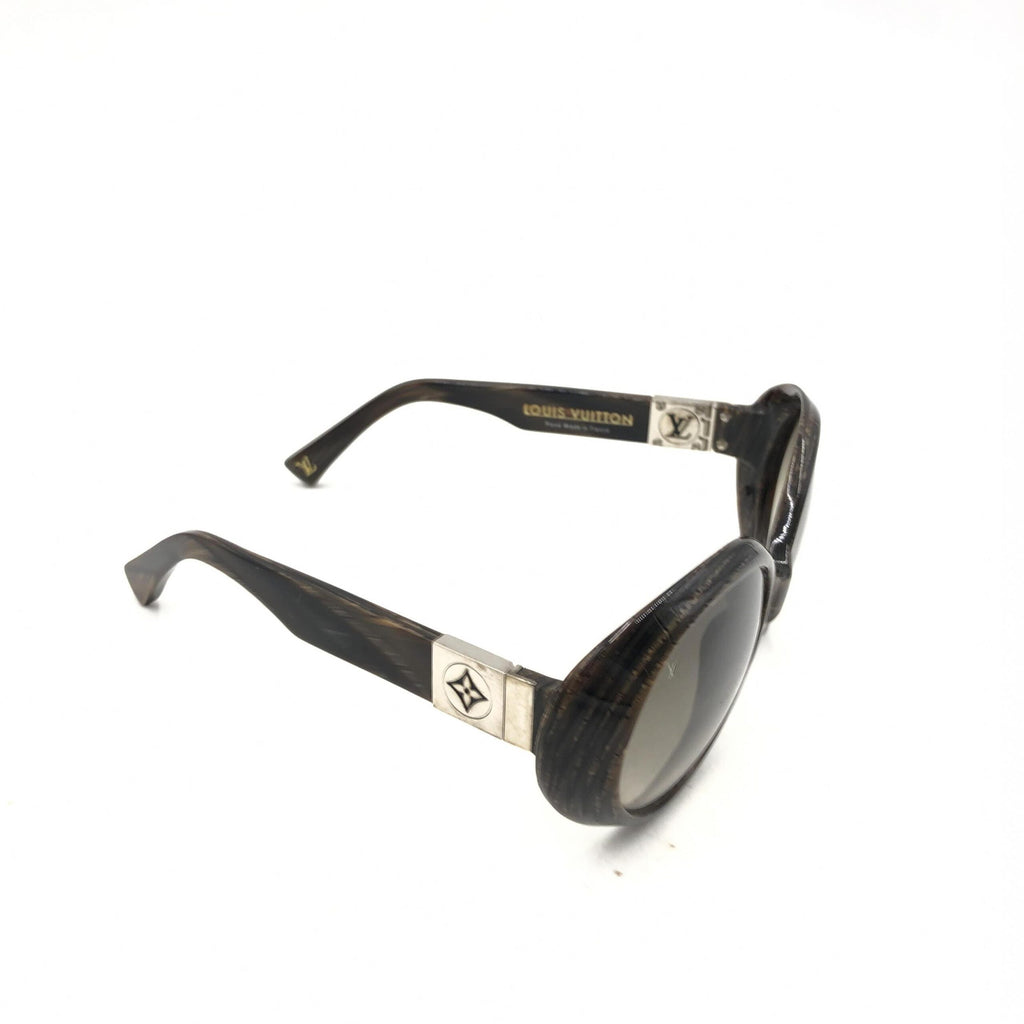 Lunettes de soleil Louis Vuitton Suspense BugEye polarisées avec monture noire et verres teintés, style élégant et moderne.