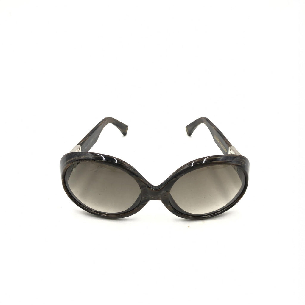 Lunettes de soleil Louis Vuitton Suspense BugEye polarisées avec monture en acétate et verres teintés, style élégant et moderne.