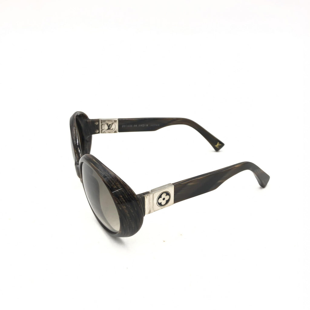 Lunettes de soleil Louis Vuitton Suspense BugEye polarisées avec monture en acétate noir et verres teintés.