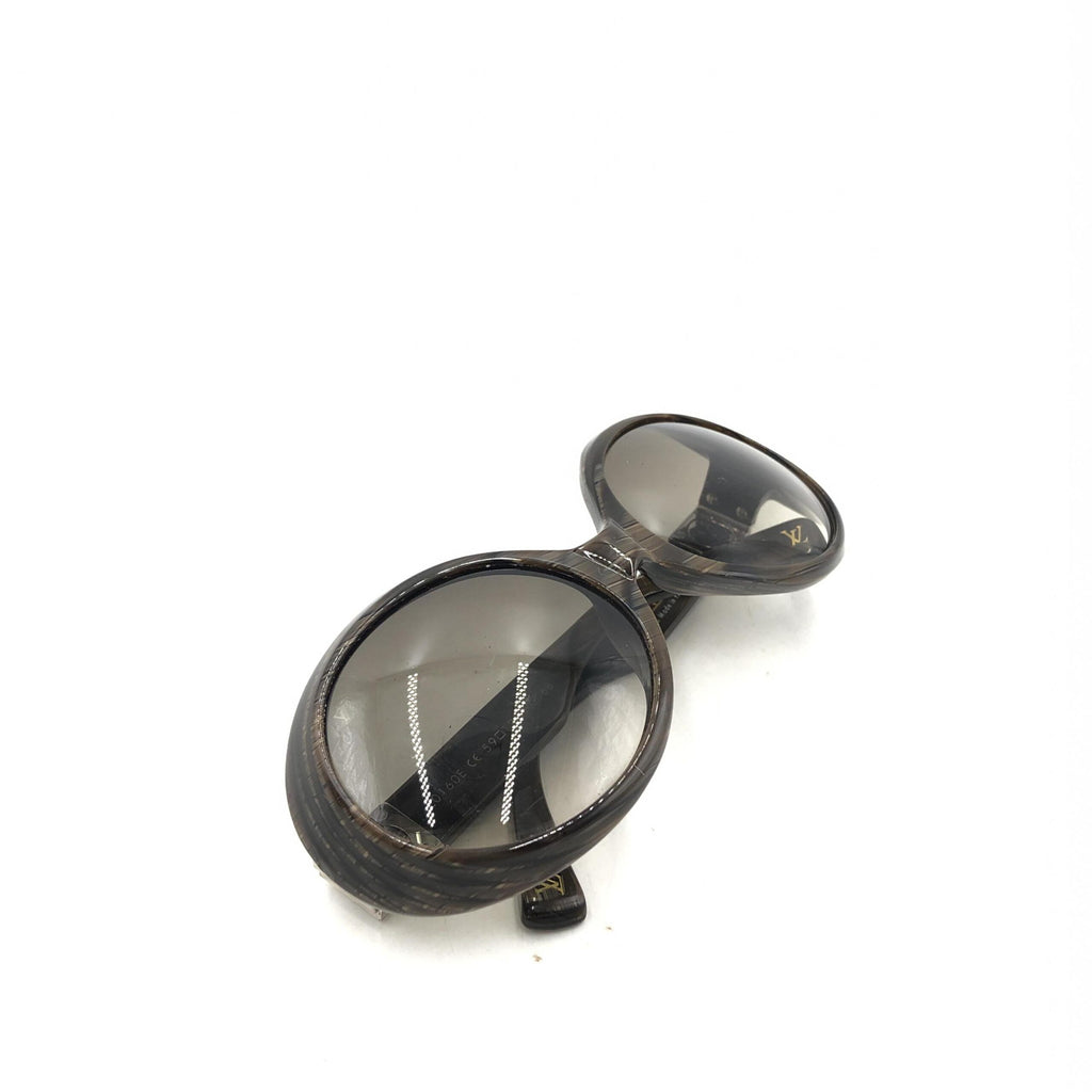 Lunettes de soleil Louis Vuitton Suspense BugEye polarisées avec monture noire et verres teintés, style élégant et moderne.