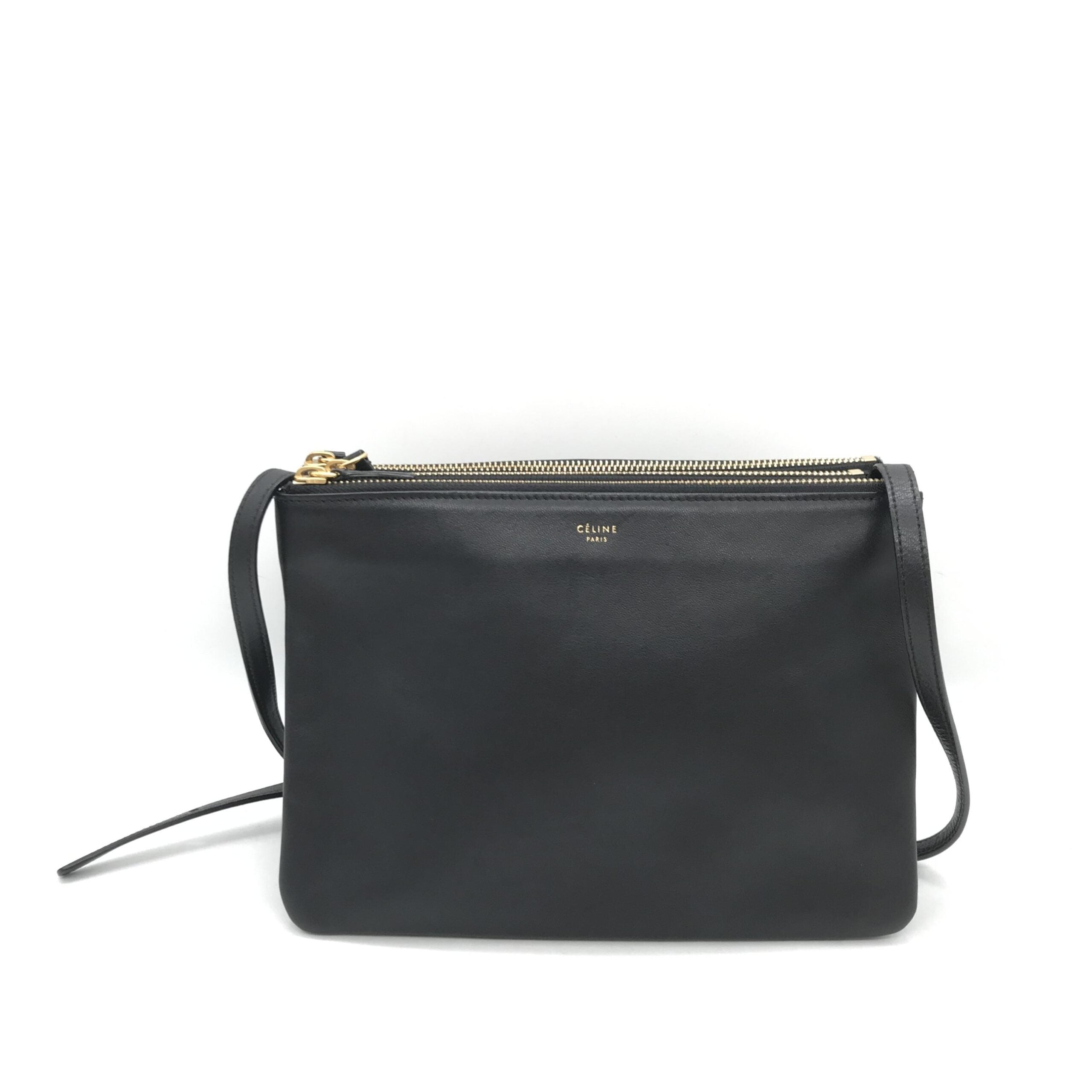 Sac à main Celine Trio en cuir noir avec bandoulière, détails élégants et design sophistiqué visible sur l'image.