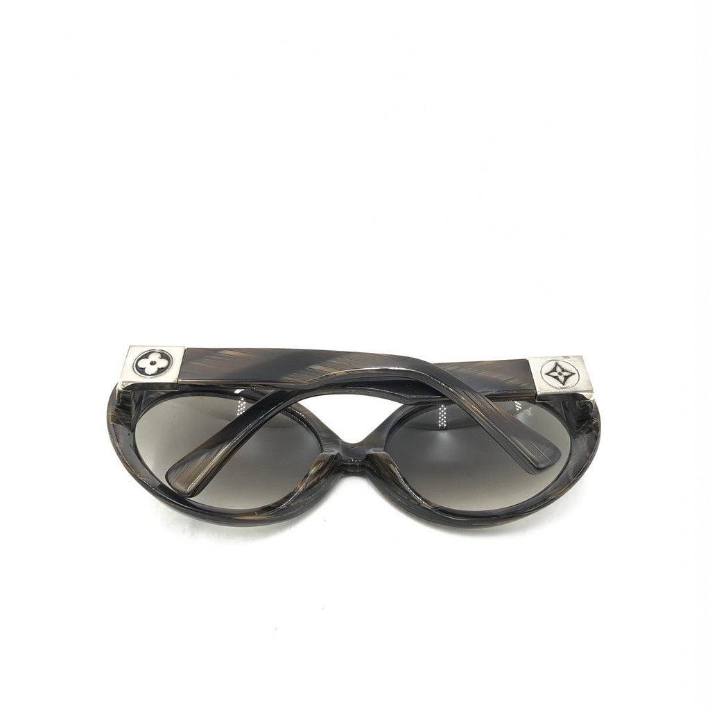 Lunettes de soleil Louis Vuitton Suspense BugEye polarisées avec monture noire et verres teintés, mode élégante et protection UV.
