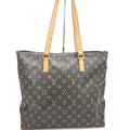 Sac cabas Louis Vuitton Monogram Mezzo, grand sac à main en toile avec logo emblématique, porté avec des poignées en cuir.