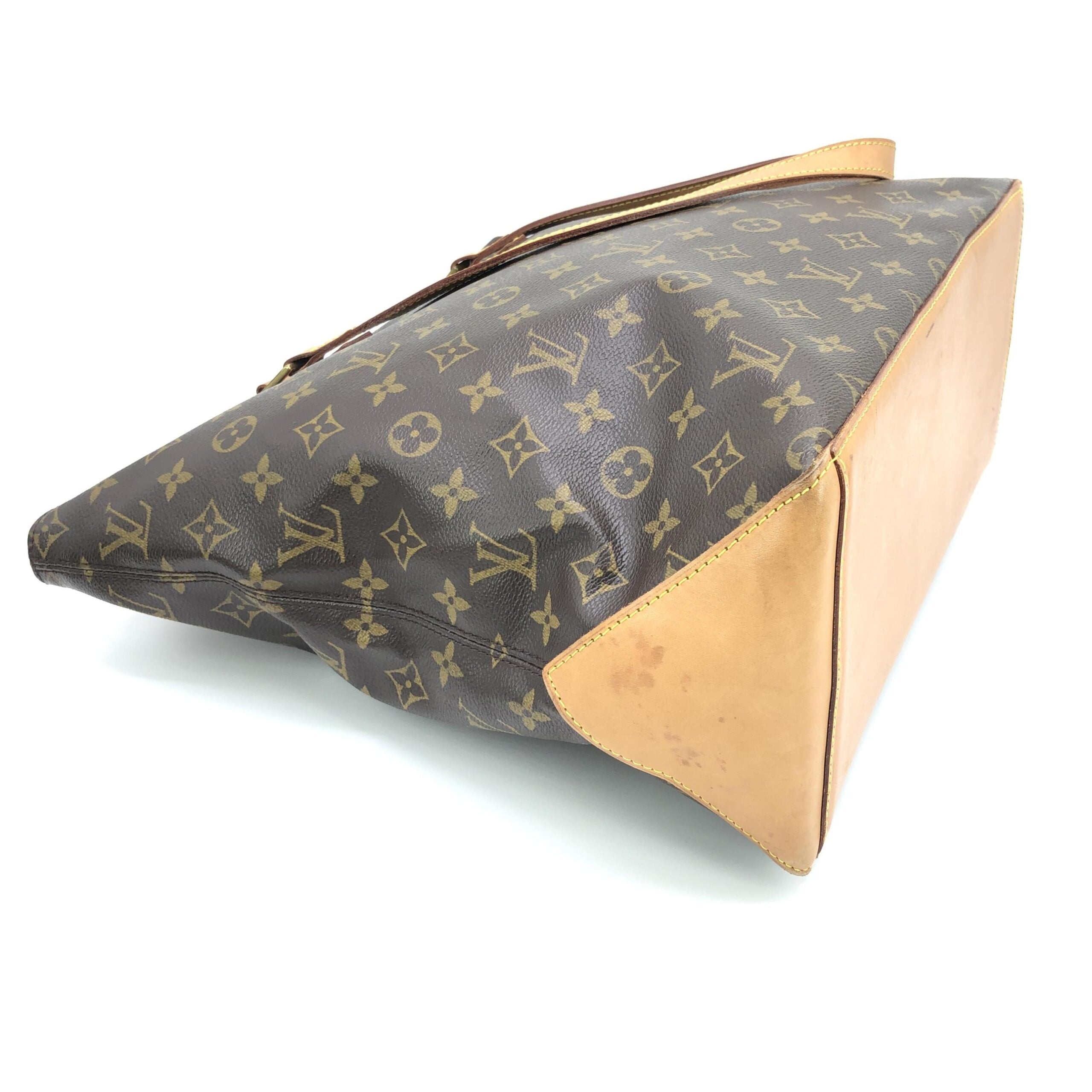 Sac cabas Louis Vuitton Monogram Mezzo, grand sac à main en toile avec motif LV, poignées en cuir et design élégant.