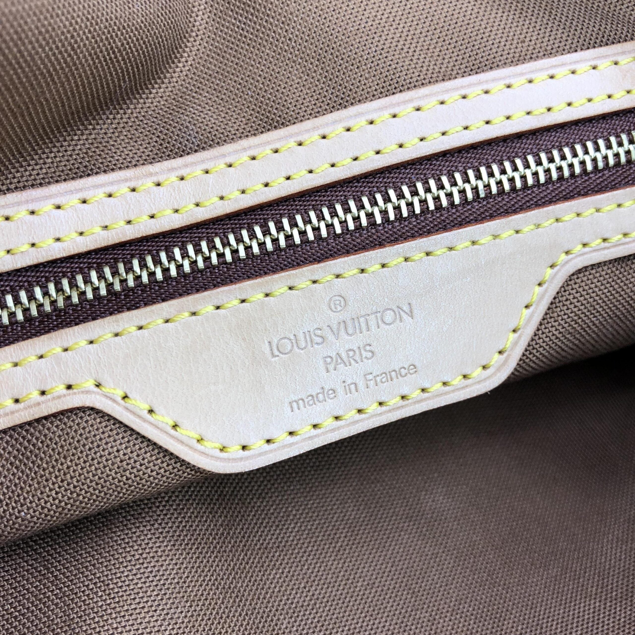 Sac cabas Louis Vuitton Monogram Mezzo, grand sac fourre-tout en toile emblématique avec poignées en cuir naturel.