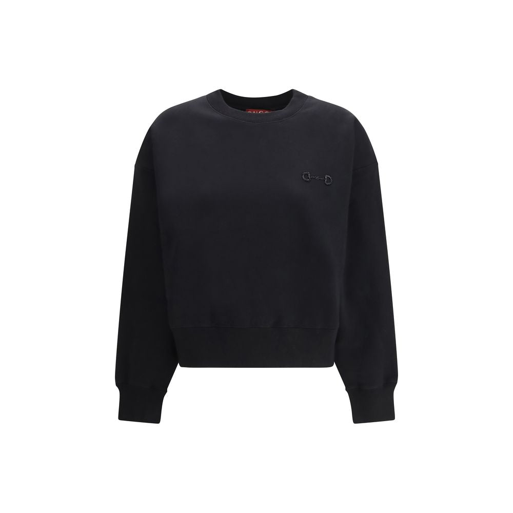 Sweat-shirt en coton noir de Gucci, style décontracté avec logo Gucci visible, porté par un mannequin.