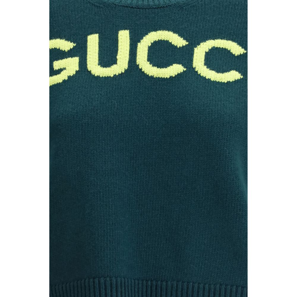 Sweat-shirt en laine bicolore Gucci, coupe décontractée, avec logo Gucci visible sur le devant.