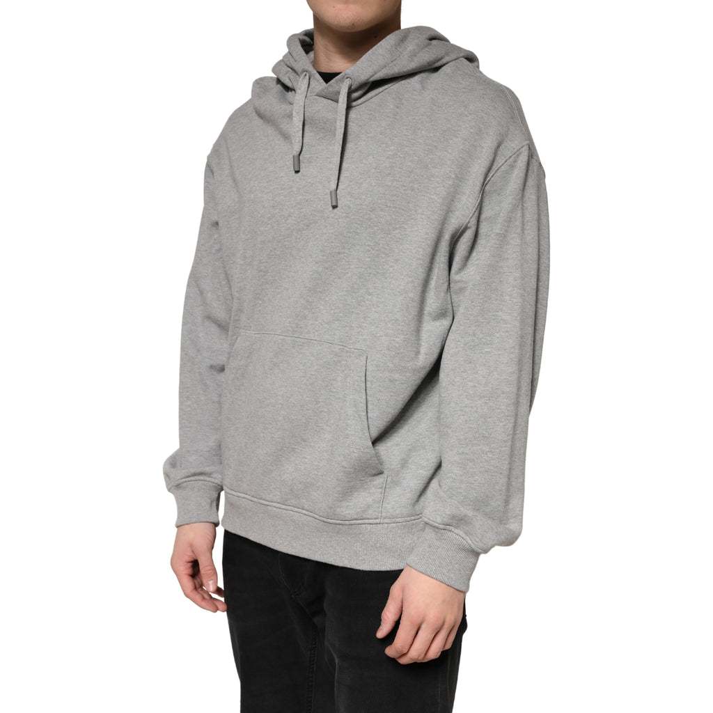 Sweat à capuche en coton gris de la marque Dolce & Gabbana, vue de face, détail du tissu et de la coupe décontractée.
