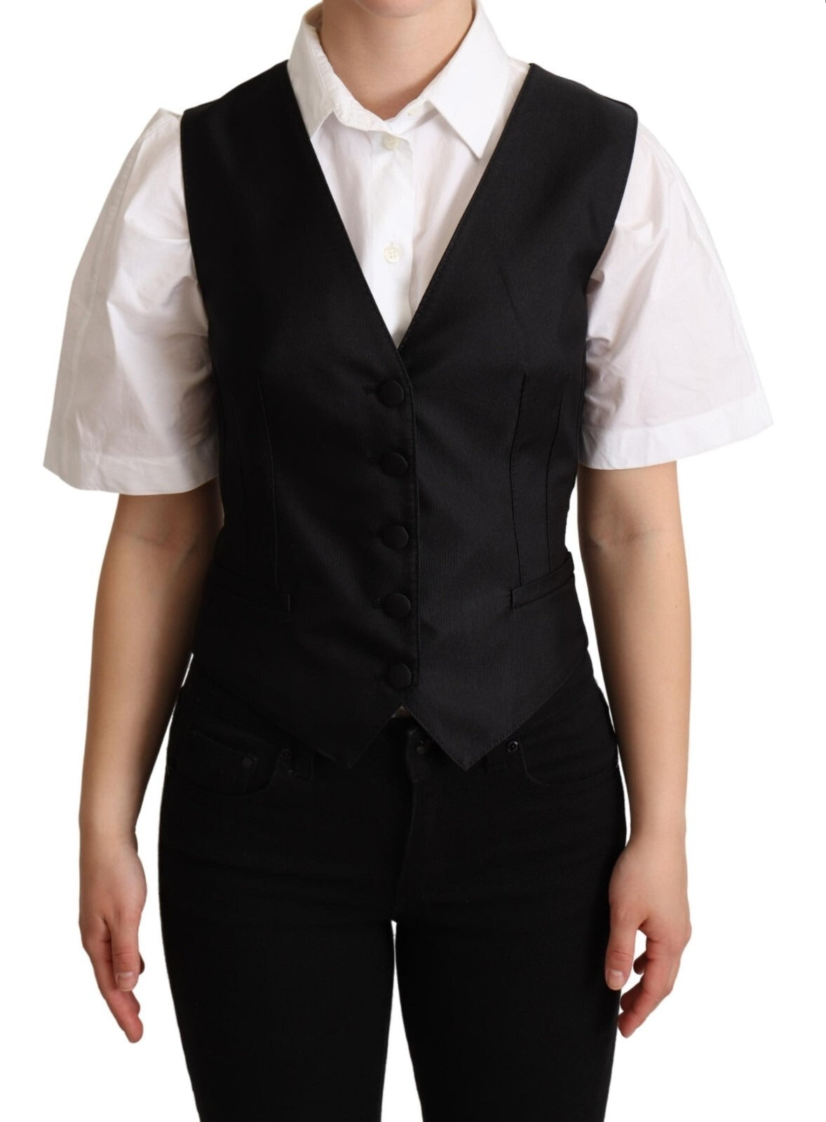 Veste sans manches en soie noire Dolce & Gabbana, ajustée à la taille, élégante et sophistiquée.