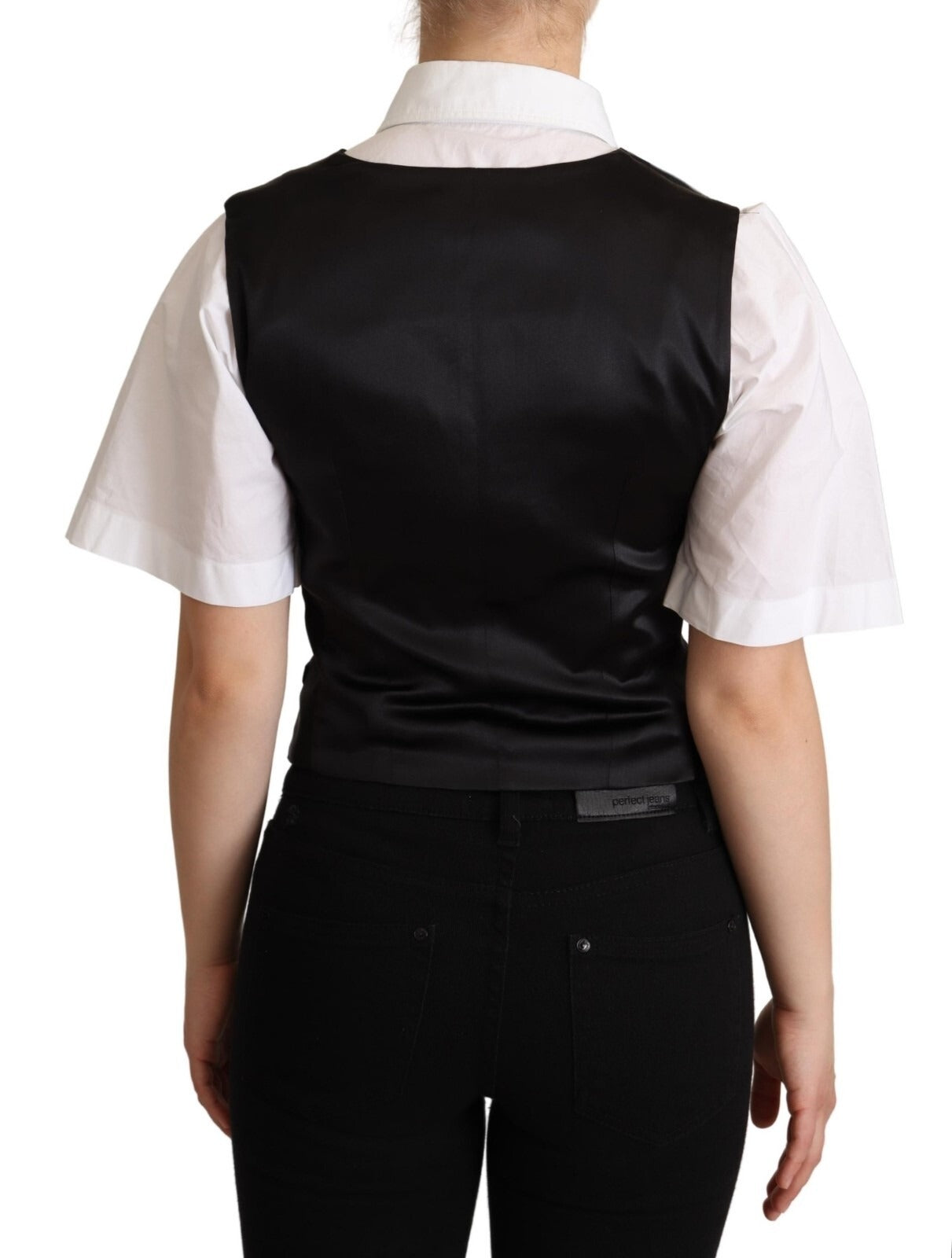 Veste sans manches en soie noire solide de Dolce & Gabbana, haut ajusté et élégant, parfait pour une tenue sophistiquée.