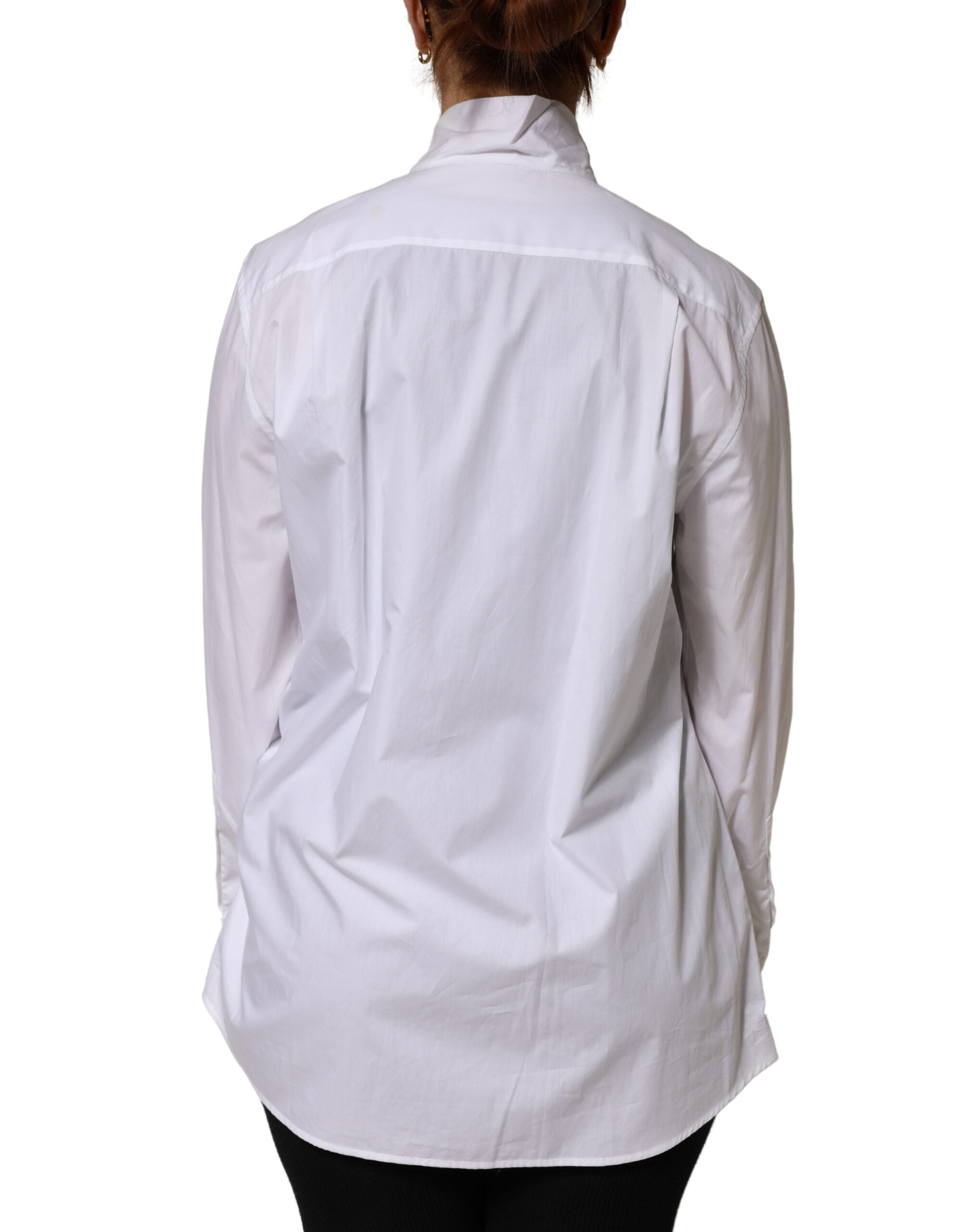 Blouse Dolce & Gabbana en coton blanc à manches longues avec nœud de satin, élégante et sophistiquée.