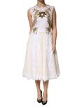Robe sans manches en soie ivoire Dolce & Gabbana avec broderies en dentelle et embellissements sophistiqués.
