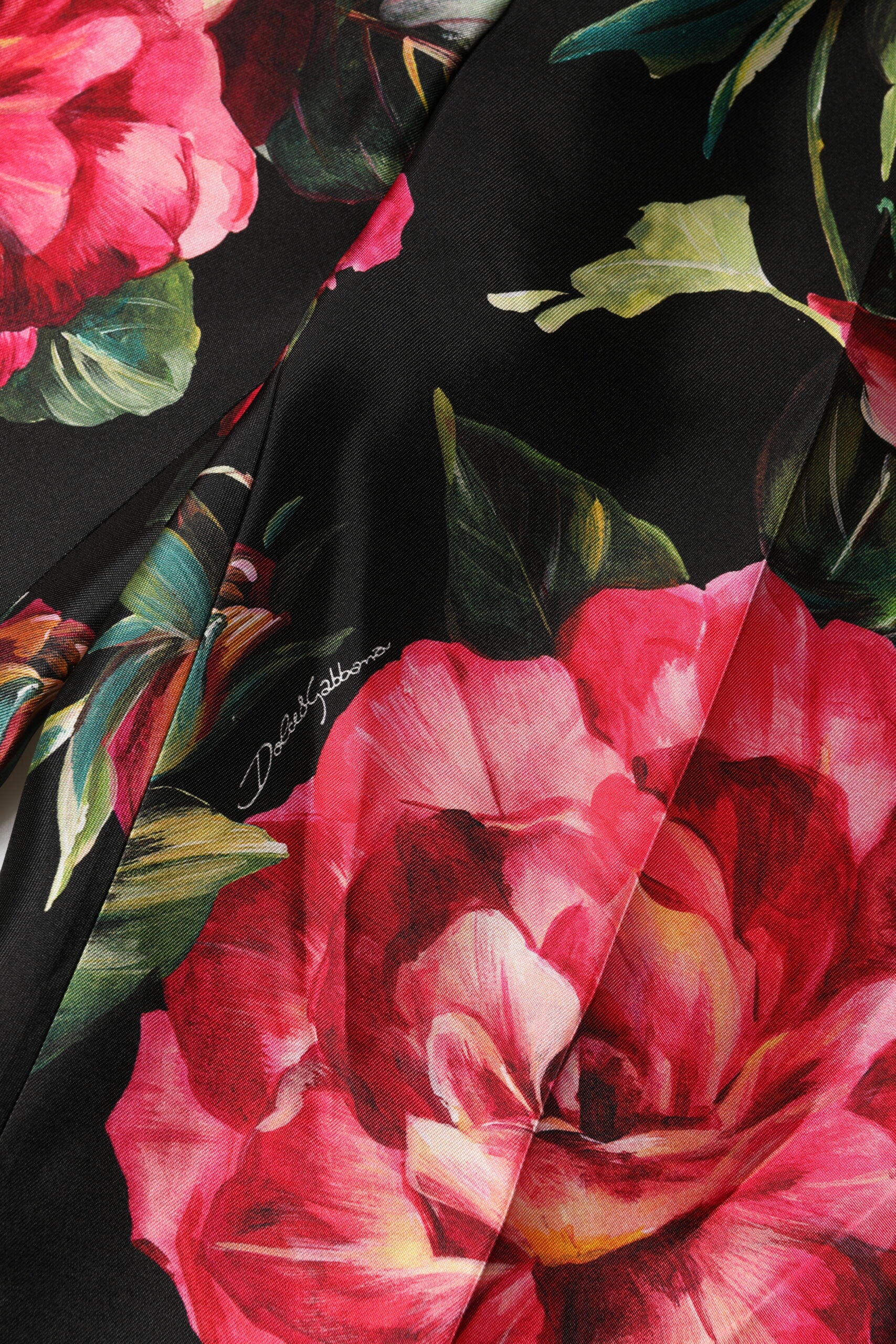 Pantalon Dolce & Gabbana en soie noire à fleurs, taille moyenne et coupe ajustée, pantalon tailleur élégant.
