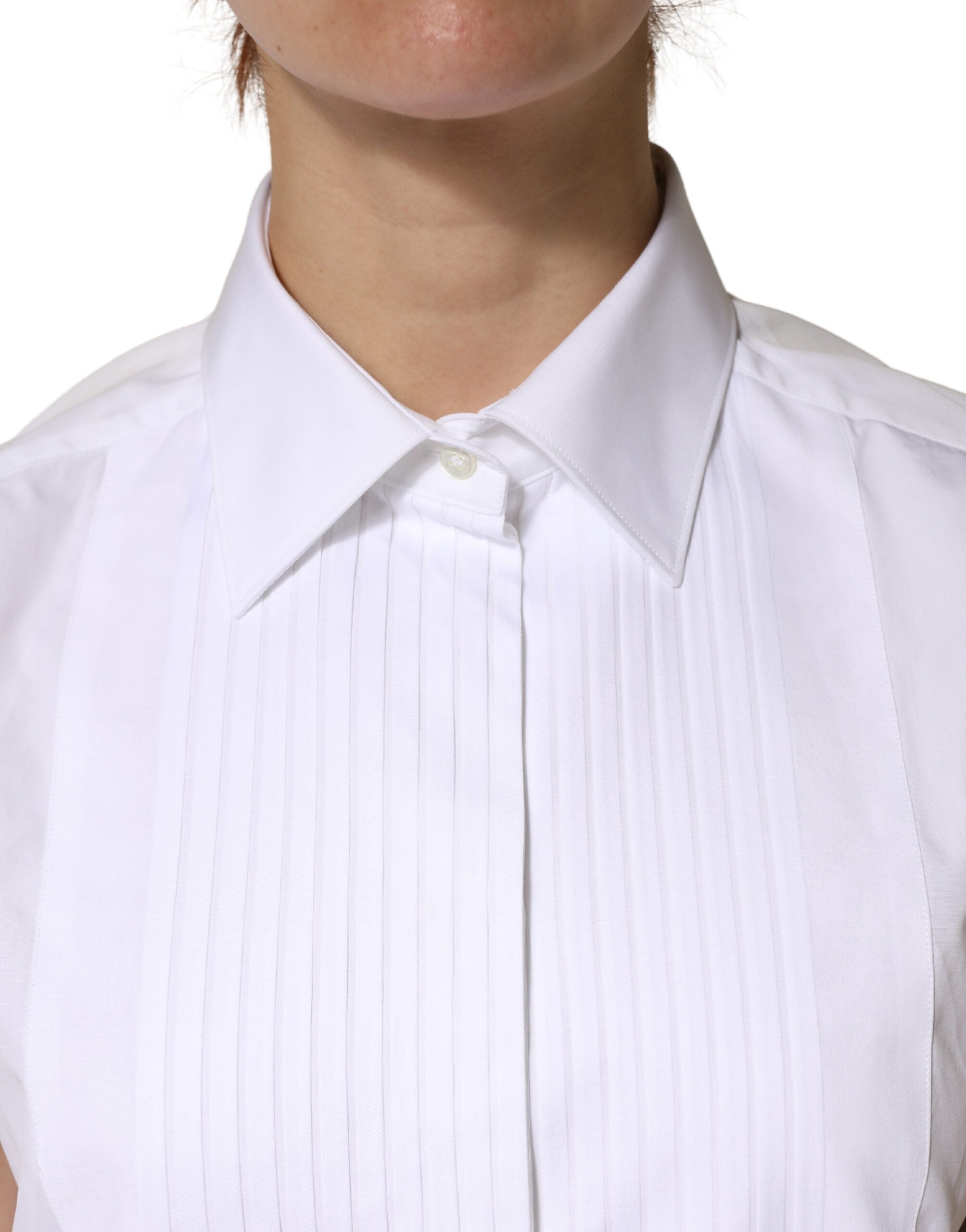 Haut sans manches blanc en coton plissé de Dolce & Gabbana avec boutons, vue de face sur le produit.