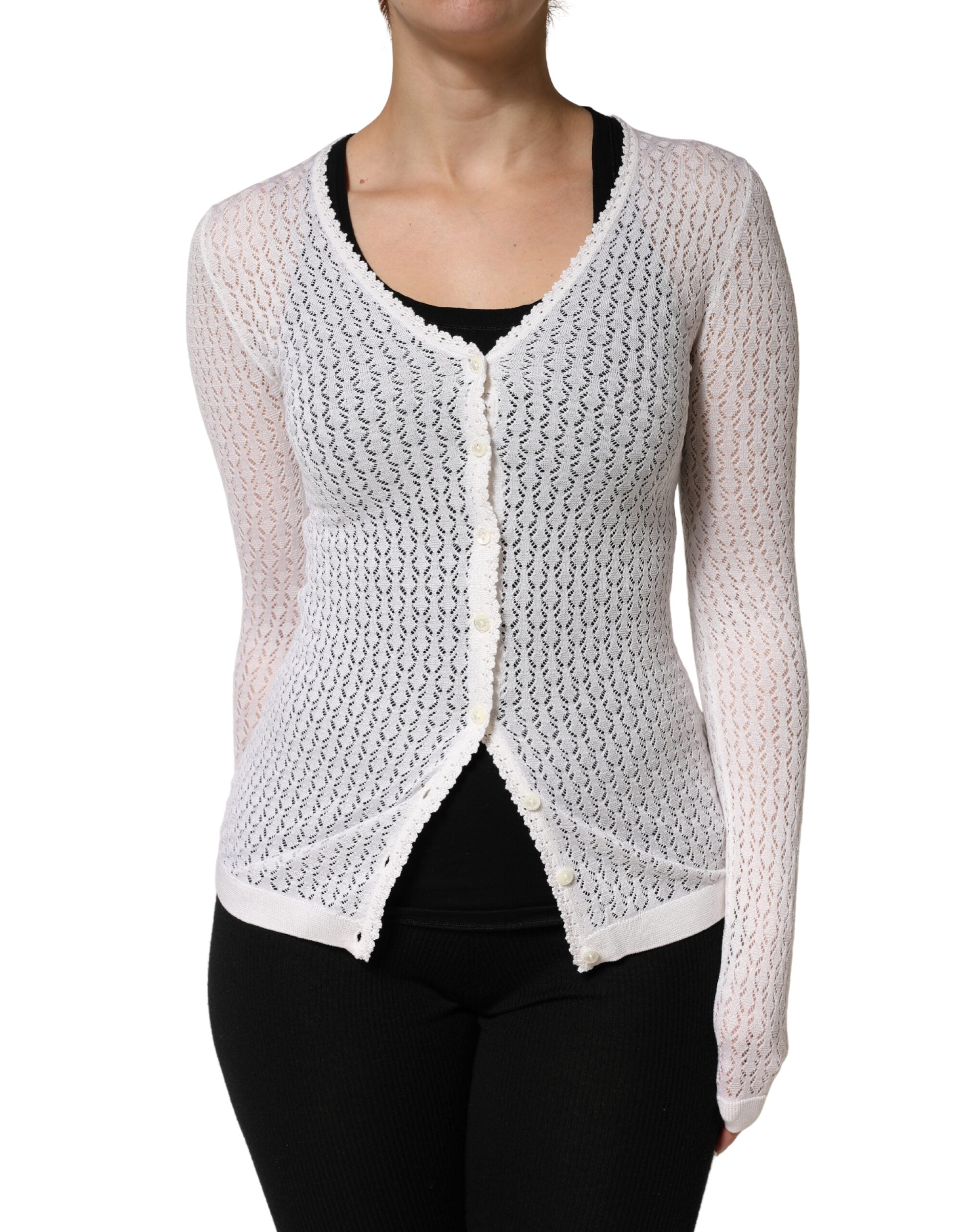 Cardigan Dolce & Gabbana en dentelle blanche en soie avec manches longues, élégance et style sophistiqué visible sur l'image.